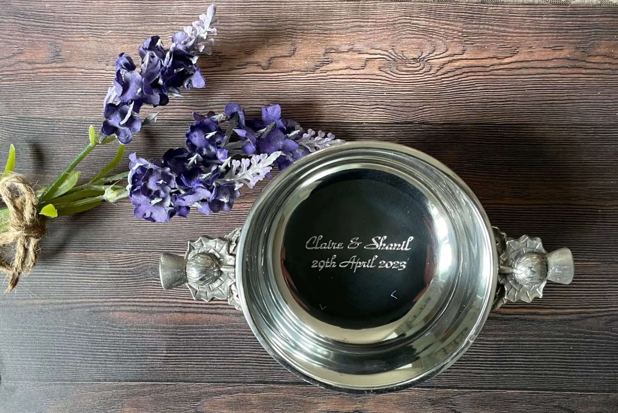 Engraved silver bowl with handles.